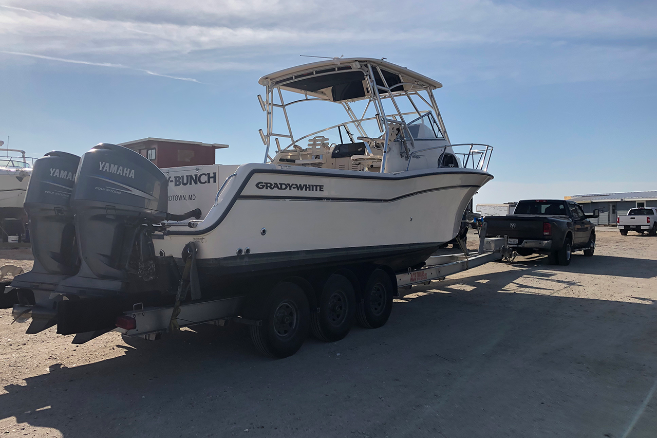 Boat loaded on a trailer for professional transport by Sabree Transport